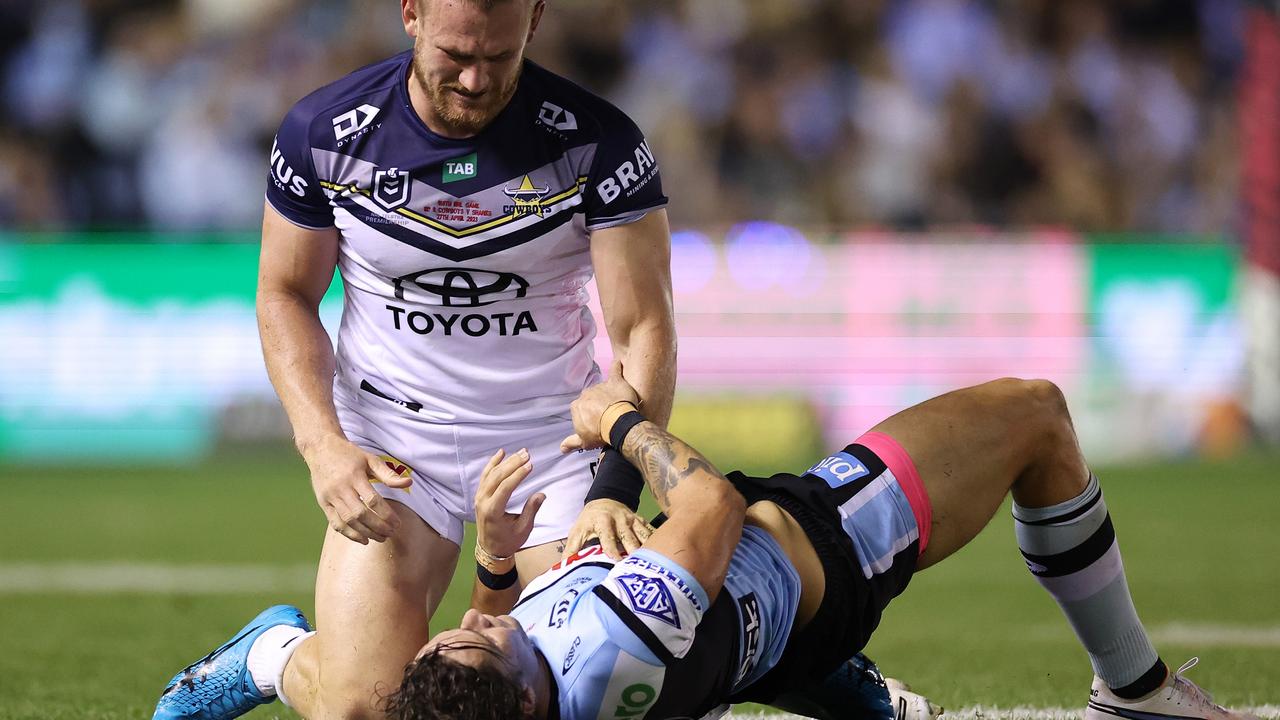 Nicho Hynes is tackled by Coen Hess.