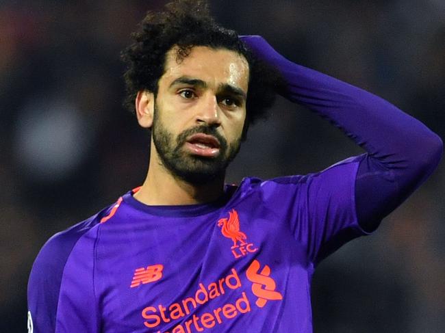 Liverpool's Egyptian forward Mohamed Salah (L) reacts  during the UEFA Champions League Group C second-leg football match between Red Star Belgrade and Liverpool FC at the Rajko Mitic Stadium in Belgrade on November 6, 2018. (Photo by Andrej ISAKOVIC / AFP)