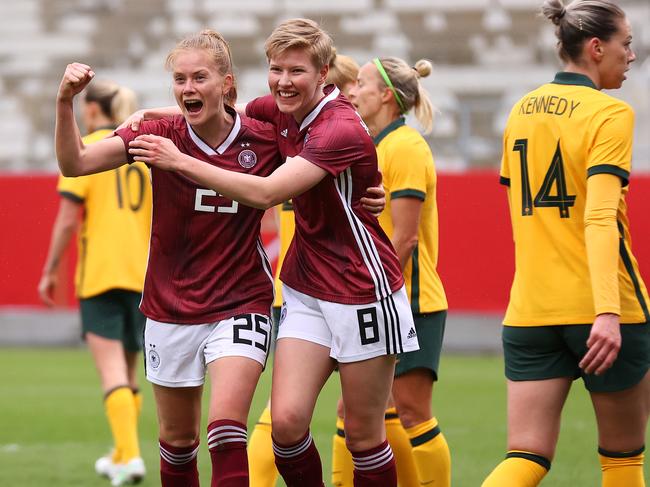 WIESBADEN, GERMANY - APRIL 10: Sjoeke Nuesken of Germany celebrates with teammate Paulina Krumbiegel after scoring her team's first goal during the Women's International Friendly match between Germany and Australia at BRITA-Arena on April 10, 2021 in Wiesbaden, Germany. Sporting stadiums around Germany remain under strict restrictions due to the Coronavirus Pandemic as Government social distancing laws prohibit fans inside venues resulting in games being played behind closed doors.  (Photo by Joosep Martinson/Getty Images)