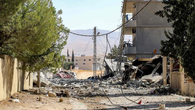 A collapsed building destroyed by an Israeli air strike is pictured in Lebanon's eastern city of Baalbek in the Bekaa Valley on October 8, 2024. (Photo by Nidal SOLH / AFP)