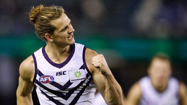 MELBOURNE, AUSTRALIA — JULY 09: Nat Fyfe of the Dockers celebrates a goal during the 2017 AFL round 16 match between the North Melbourne Kangaroos and the Fremantle Dockers at Etihad Stadium on July 09, 2017 in Melbourne, Australia. (Photo by Adam Trafford/AFL Media/Getty Images)