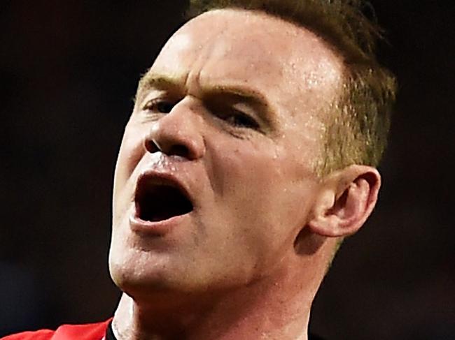 MANCHESTER, ENGLAND - MARCH 09: Wayne Rooney of Manchester United celebrates after scoring a goal to level the scores at 1-1 during the FA Cup Quarter Final match between Manchester United and Arsenal at Old Trafford on March 9, 2015 in Manchester, England. (Photo by Laurence Griffiths/Getty Images)