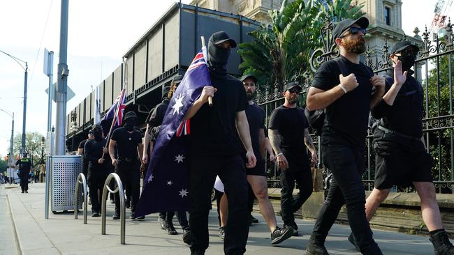 A group of neo-Nazi sympathisers try to join the No to the Voice protesters during a rally in Melbourne.Picture: NCA NewsWire / Luis Enrique Ascui