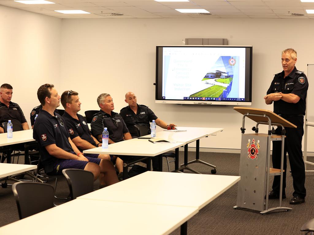 Jock Crome manager of business operations at Townsville Fire and Rescue HQ givens briefing to crew arriving from south to lend assistance for the looming cyclone. Pics Adam Head