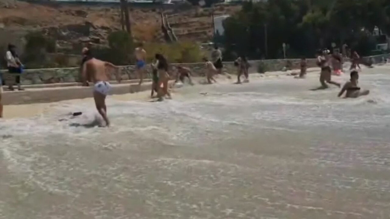 Beachgoers were hit by the raging sea as they rushed to find cover. Picture: Facebook