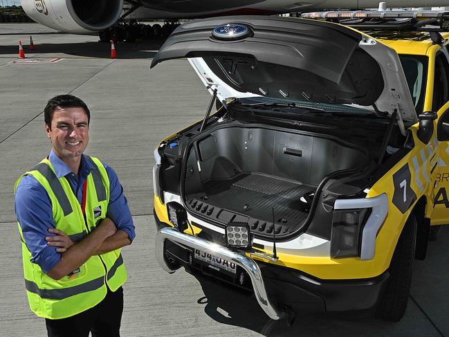 24/09/2024: Eddie Kocwa, co owner of the BOSSCAP Group, with one of the Ford Lightning F-150 EV utes specially made for the Brisbane Airport Corporation, at Brisbane airport. The company modifies the US made ute into Australias only EV 4x4 ute, at their factory in Brendale, Brisbane  pic: Lyndon Mechielsen/The Australian