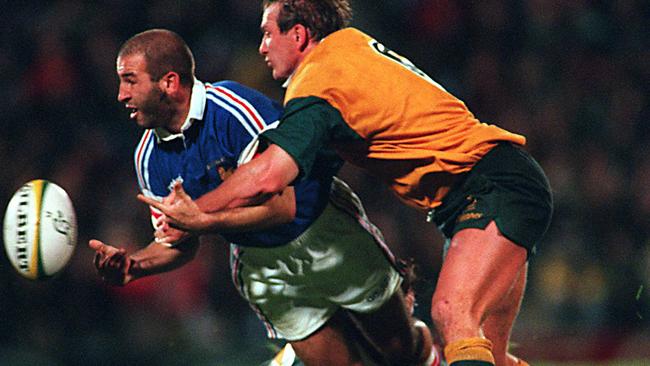 Brett Robinson tackles during the Wallabies victory over France at Ballymore in 1997/