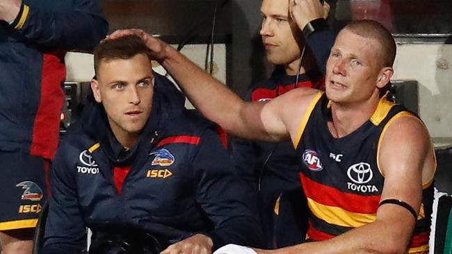 An emotional Sam Jacobs consoles Brodie Smith after he ruptured his ACL on Thursday night. Picture: Michael Willson/AFL Media/Getty Images