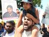 Twin brother of shooting victim leads protest