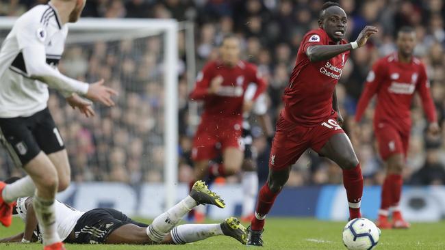 Liverpool's Sadio Mane runs with the ball during the English Premier League soccer match between Fulham and Liverpool at Craven Cottage stadium in London, Sunday, March 17, 2019. (AP Photo/Kirsty Wigglesworth)