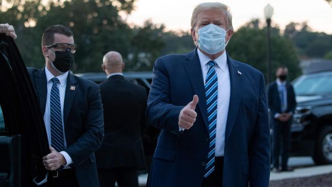 US President Donald Trump gives the thumbs up as he leaves Walter Reed Medical Centre, where he was treated for coronavirus, to return to the White House after being discharged. Picture: AFP