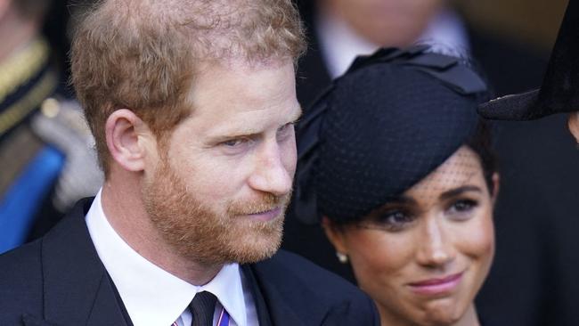 Britain's Prince Harry (L), Duke of Sussex, and Meghan (C), Duchess of Sussex, leave after paying their respects at Westminster Hall, at the Palace of Westminster, where the coffin of Queen Elizabeth II, will Lie in State on a Catafalque, in London on September 14, 2022. - Queen Elizabeth II will lie in state in Westminster Hall inside the Palace of Westminster, from Wednesday until a few hours before her funeral on Monday, with huge queues expected to file past her coffin to pay their respects. (Photo by Danny Lawson / POOL / AFP)