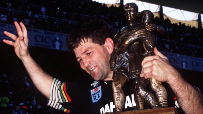 Hooker Royce Simmons celebrates with the trophy after Penrith won the 1991 grand final.