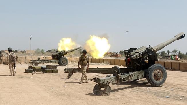 Iraqi forces fire artillery towards Islamic State positions west of the Iraqi capital Baghdad. Picture: AFP/Ahmad al-Rubaye