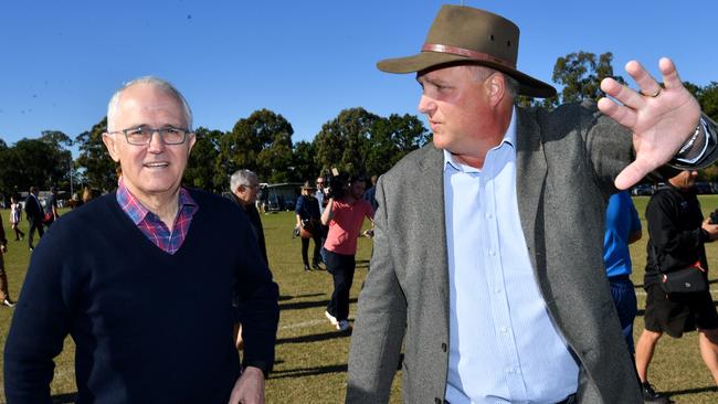 Prime Minister Malcolm Turnbull and LNP candidate for Longman Trevor Ruthenberg at the Caboolture Sports Football Club. Picture: Darren England/AAP