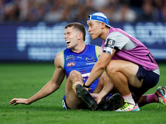 Callum Coleman-Jones in pain on the Marvel Stadium turf. Picture: Dylan Burns/AFL Photos via Getty Images