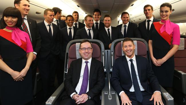 The 2013 Australian cricket team with then captain Michael Clarke and Qantas CEO Alan Joyce.