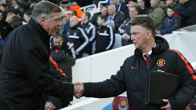 Manchester United’s manager Louis Van Gall, right, shakes hands with West Ham United’s manager Sam Allardyce before the English Premier League soccer match between West Ham United and Manchester United at the Boleyn Ground in London, Sunday, Feb. 8, 2015. (AP Photo/Alastair Grant)