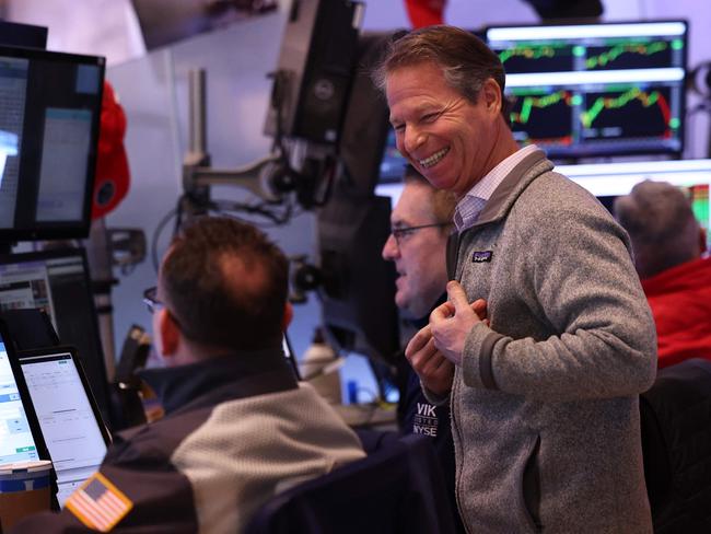 NEW YORK, NEW YORK - JANUARY 22: Traders work on the floor of the New York Stock Exchange during morning trading on January 22, 2025 in New York City. Stocks continued an upward swing opening up high a day after the Dow Jones closed up 500 points and the S&P 500 approaching an all-time high. The rise comes after OpenAI CEO Sam Altman, SoftBank CEO Masayoshi Son and Oracle Chairman Larry Ellison made an announcement alongside President Donald Trump that they will create a new company, called Stargate, to grow artificial intelligence infrastructure in the U.S.   Michael M. Santiago/Getty Images/AFP (Photo by Michael M. Santiago / GETTY IMAGES NORTH AMERICA / Getty Images via AFP)