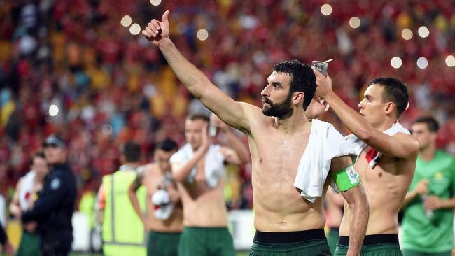 Australia's Mile Jedinak (C) and Trent Sainsbury (R) celebrate.