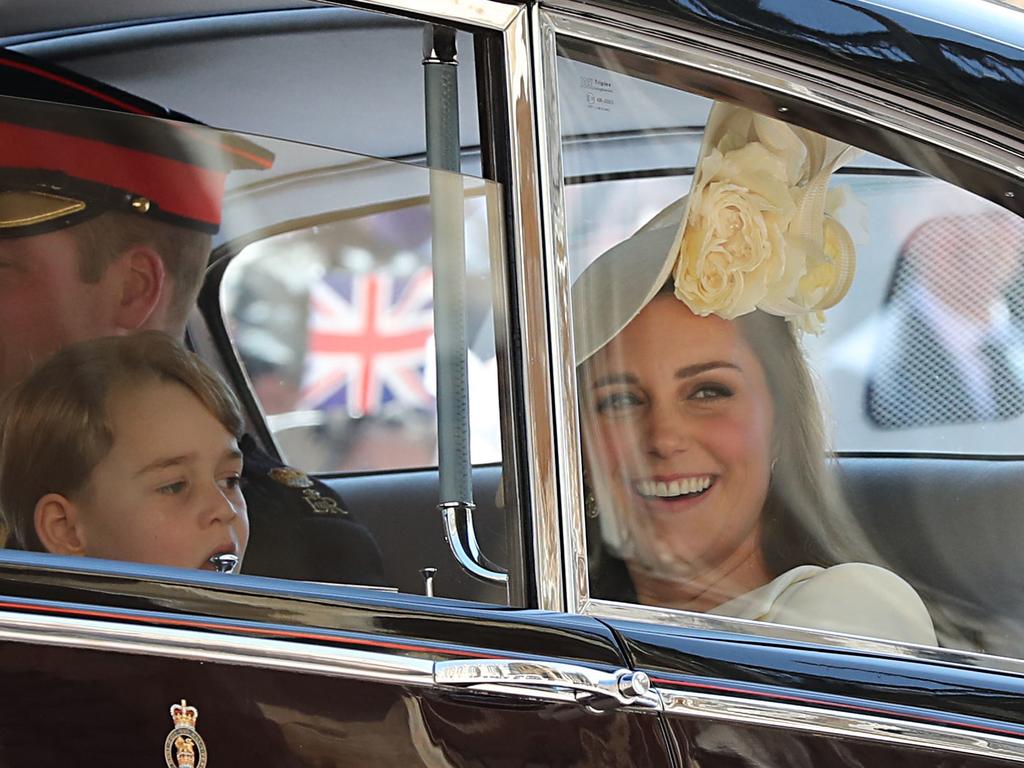 Kate Middleton with Prince George, left, at Prince Harry and Meghan Markle’s wedding. Picture: AFP