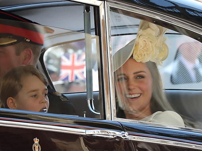 Kate Middleton with Prince George, left, at Prince Harry and Meghan Markle’s wedding. Picture: AFP