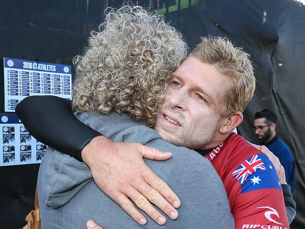 Australia's Mick Fanning hugs his mother Liz after a surf heat at the World Surf League World Tour Rip Curl Pro Bells Beach in 2018. Picture: Ian Currie