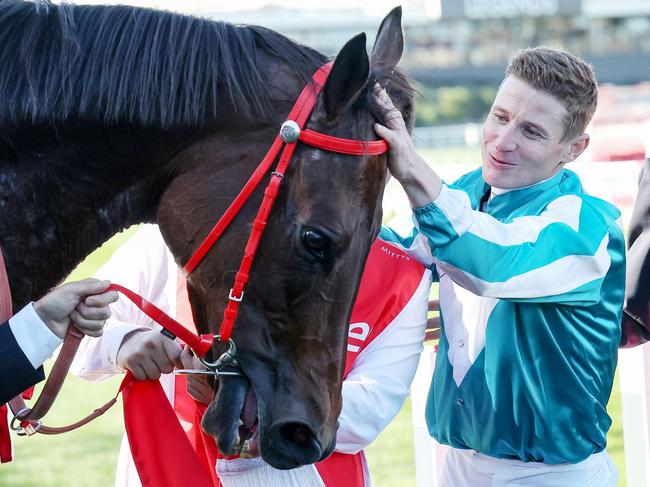 James McDonald and Romantic Warrior (IRE) with connections after winning the Ladbrokes Cox Plate at Moonee Valley Racecourse on October 28, 2023 in Moonee Ponds, Australia. (Photo by George Sal/Racing Photos via Getty Images)