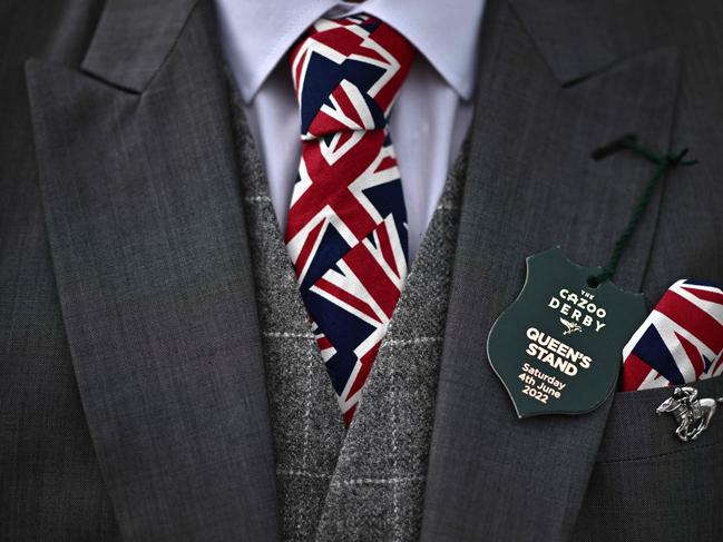 A racegoer wearing a Union flag tie and handkerchief attends the second day of the Epsom Derby Festival. Picture: AFP