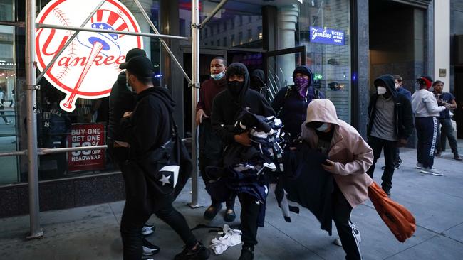 Looters after raiding a shop in New York. Picture: AFP