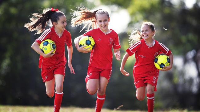 Three players from the Kirrawee Kangaroos football team.