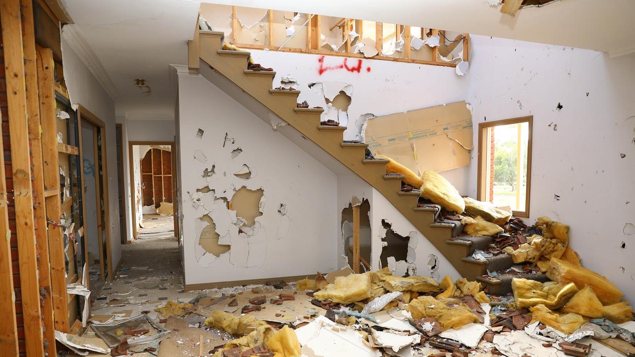 Neighbours say young people often gather in large numbers in the home, with squatters taking up residence in them earlier in the year. Picture: Alison Wynd