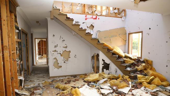 Neighbours say young people often gather in large numbers in the home, with squatters taking up residence in them earlier in the year. Picture: Alison Wynd