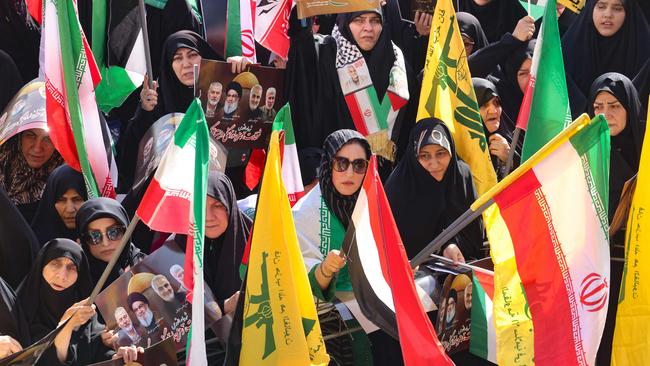 Demonstrators wave Palestinian, Iranian and Hezbollah flags during a rally in Tehran on October 2, 2024, a day after Iran fired a barrage of missiles at Israel. Picture: AFP