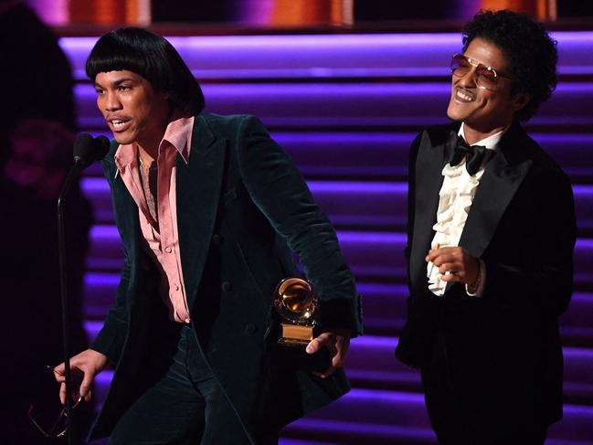 Bruno Mars, right, smoked on stage, drawing backlash from fans. Picture: Getty Images