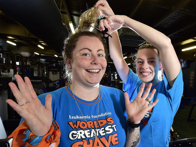 Townsville mum Emma Buddeke will shave her mid-back length hair for the 2nd time on March 14 as part of World's Greatest Shave, and the first cut will be done by good friend Amanda Jones. PICTURE: MATT TAYLOR.