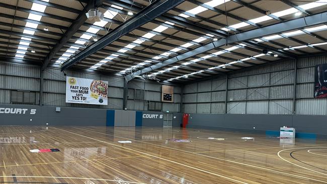 Towels strewn across courts to pad any roof leaks.