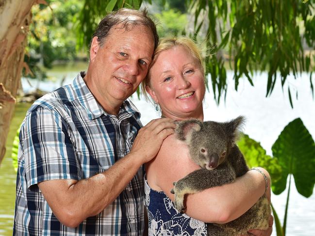 John and Bridget Morgan visiting from Oregon, U.S. holding Puzzle the Koala at Billabong Sanctuary. Picture: Shae Beplate.