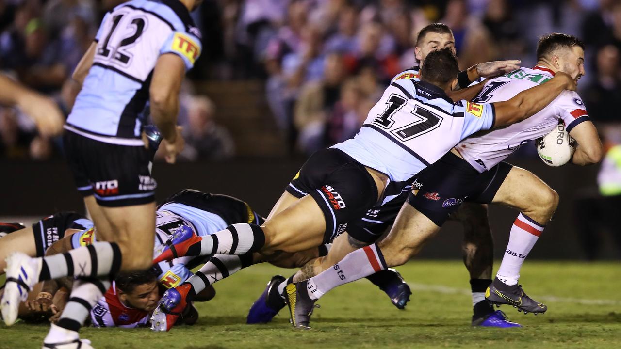 Tedesco breaks away to score a try against the Sharks. Image: Mark Kolbe/Getty Images