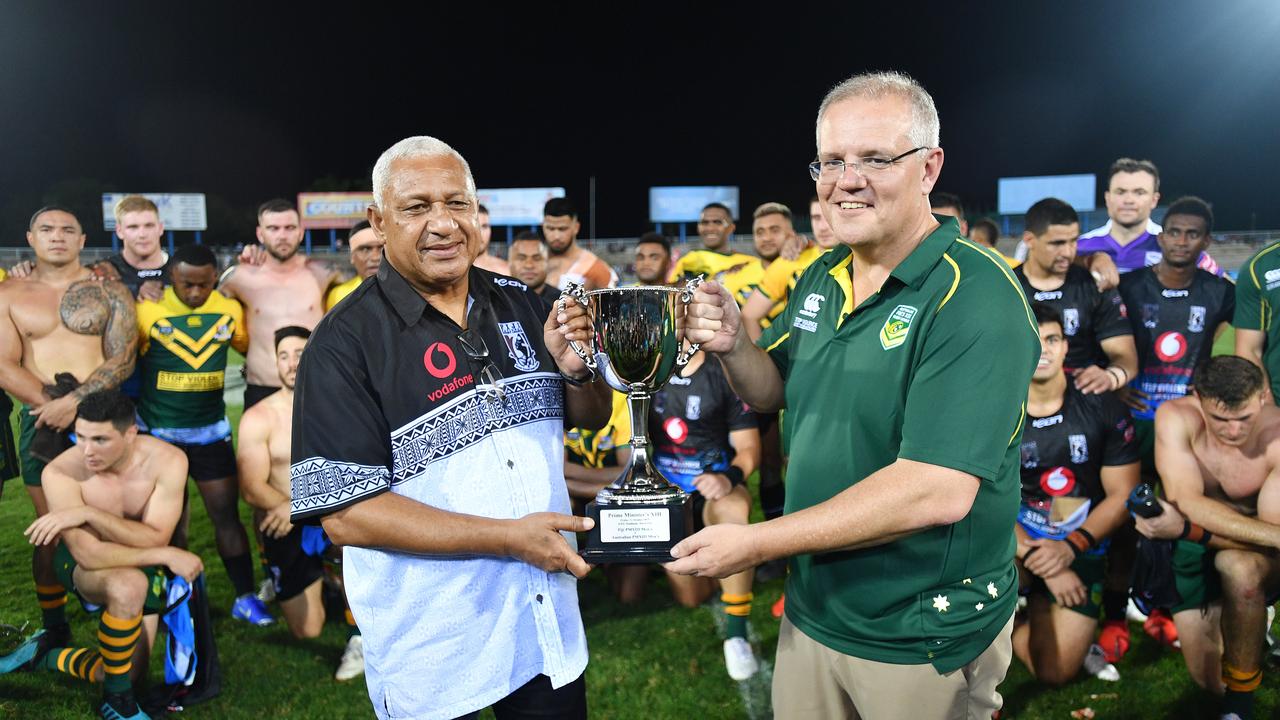 Prime Minister Scott Morrison with Prime Minister Frank Bainimarama after the game between Australia and Fiji.