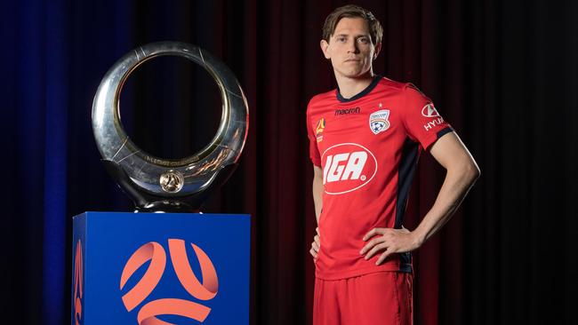 Adelaide United star Craig Goodwin with the trophy at the season launch on Monday. Picture: Mark Metcalfe/Getty Images