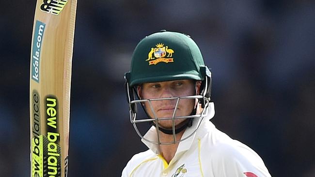 Australian captain Steve Smith raises his bat after scoring a half-century. Photo: AAP