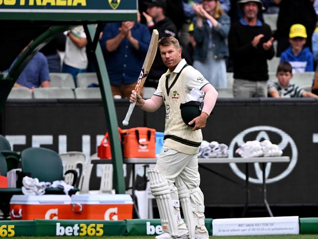 Australian batsman David Warner waves to the fans after being dismissed on the third day of the second cricket Test match between Australia and Pakistan at the Melbourne Cricket Ground (MCG) in Melbourne on December 28, 2023. (Photo by William WEST / AFP) / --IMAGE RESTRICTED TO EDITORIAL USE - STRICTLY NO COMMERCIAL USE--