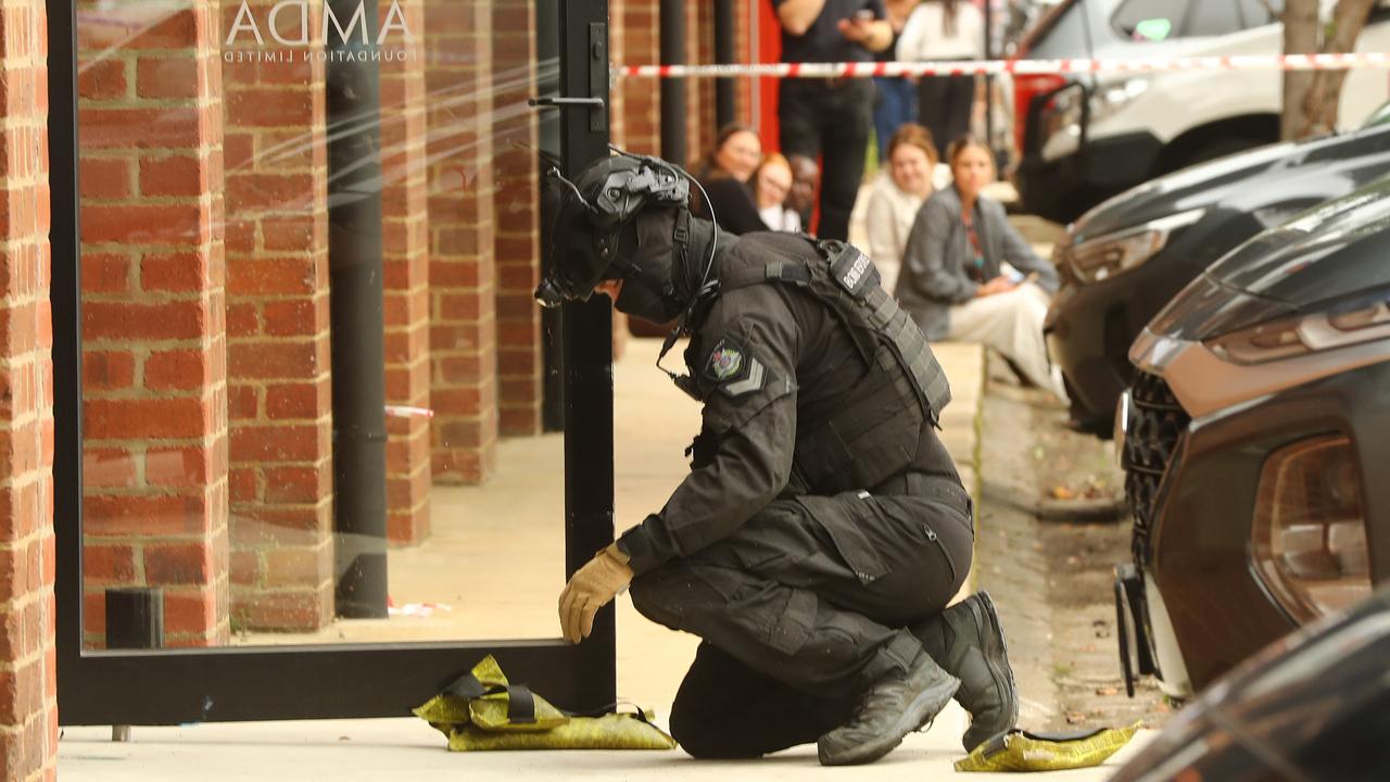 The bomb squad at work at AMDA in Mackay St, North Geelong after a suspicious package was delivered. Picture: Alison Wynd