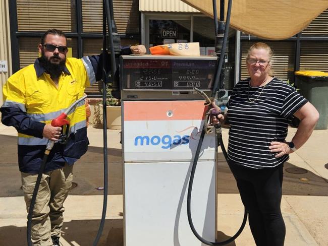 MOGAS Cookes Outback Motorsowner Kim Logan, pictured with local Jessie Evans, said the situation was dire for many of the residents. Picture: Supplied