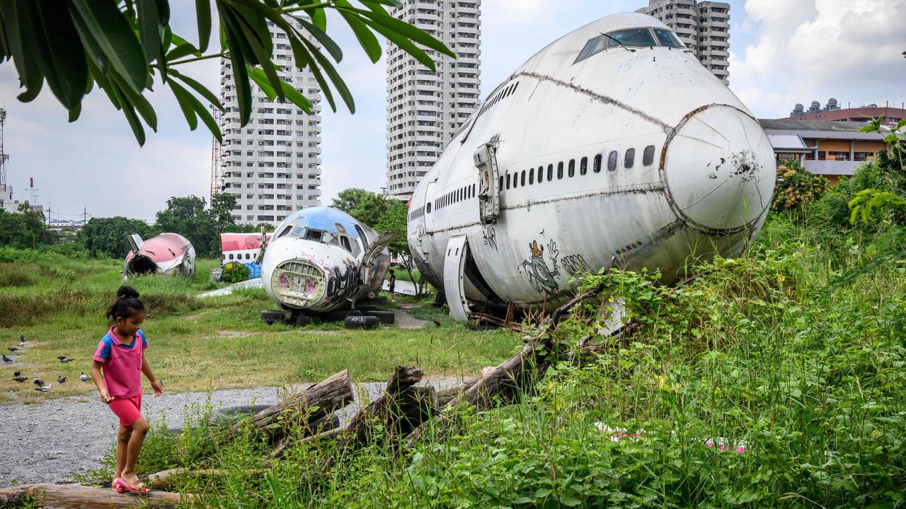 A child plays in front of the abandoned aircraft, which started accumulating since 2010. Picture: Mladen Antonov / AFP