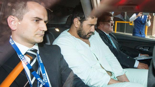 Accused Flinders Street rampage driver Saeed Noori leaves Melbourne West Police Station with police officers. Picture: Mark Stewart