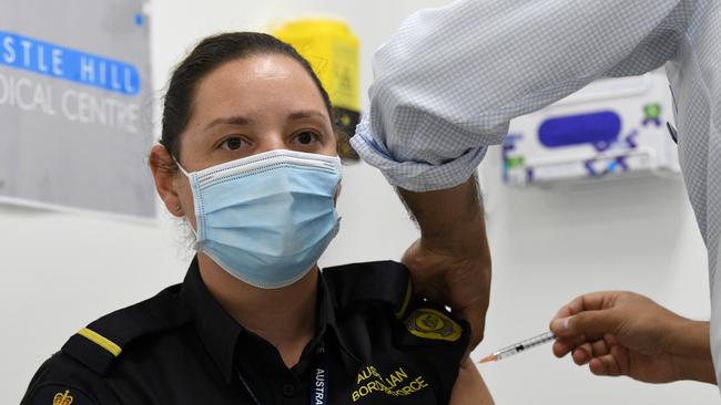 Australian Border Force Quarantine worker Alysha Eyre is seen receiving her second and final COVID-19 vaccination shot at the Castle Hill Medical Centre. Picture: NCA NewsWire/Bianca De Marchi