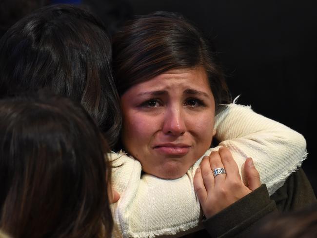 Supporter of Democratic presidential nominee Hillary Clinton react to television reports during election night at the Jacob K. Javits Convention Center in New York on November 8, 2016. / AFP PHOTO / Robyn BECK