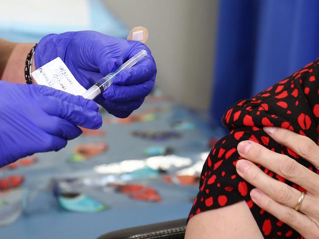 The AstraZaneca COVID-19 vaccine is now available to eligible 1B patients at selected Cairns General practice clinics. Omega Health Medical Practice principal Melissa Hikila receives her coronavirus vaccination jab from registered nurse Jenni McCurdy. Picture: Brendan Radke